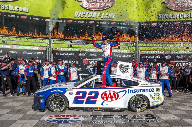 Joey Logano celebrating in victory lane