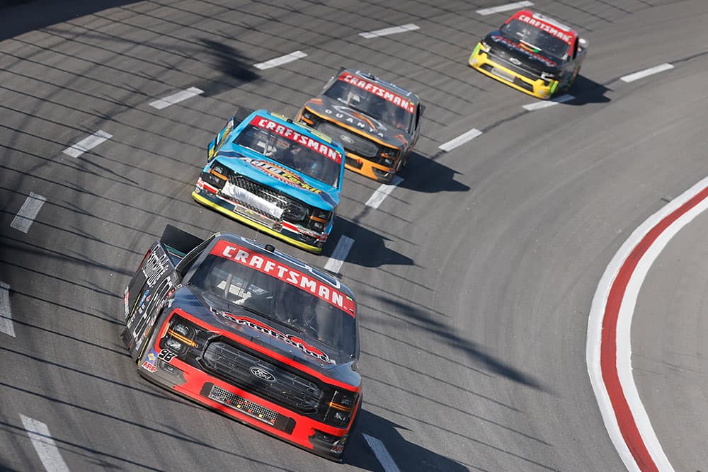 Multiple Craftsman Truck vehicles on a race track