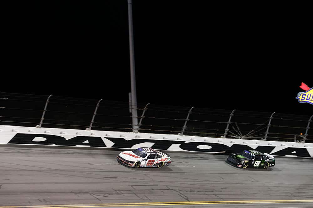 Several cars on the track at Daytona