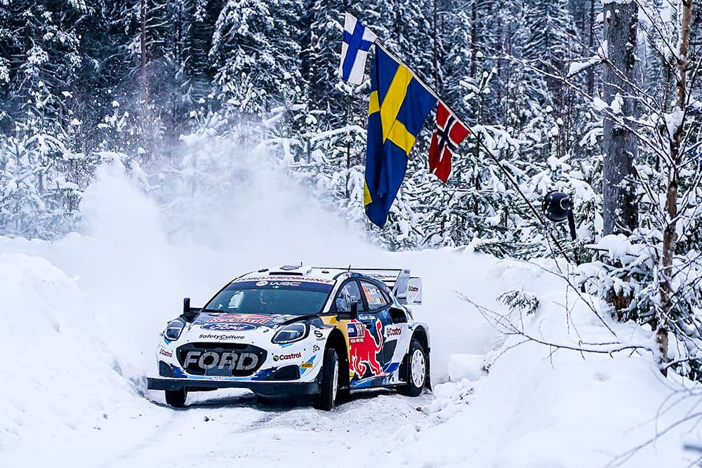 Ford Rally car racing in snow