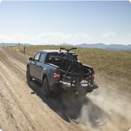 Ford truck in motion on dirt road
