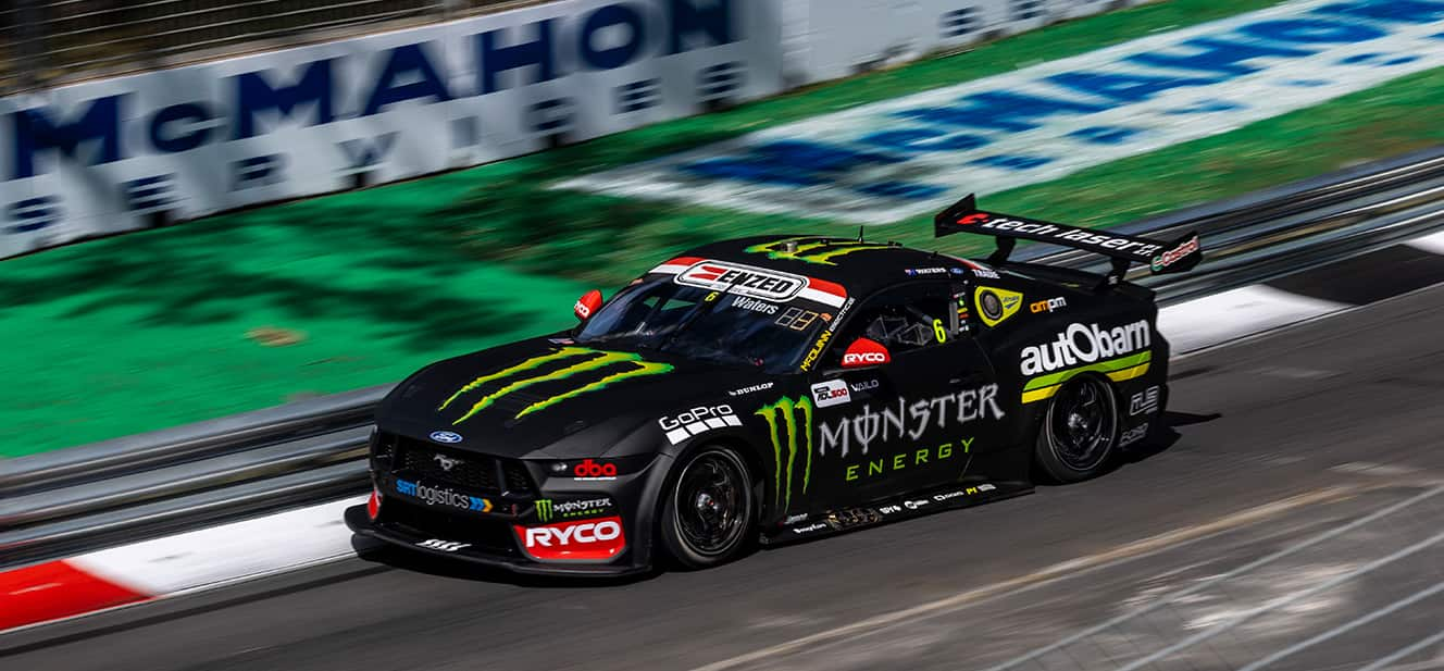 Cameron Waters' Green and Black Number 6 Monster Energy Ford Mustang GT race car on track