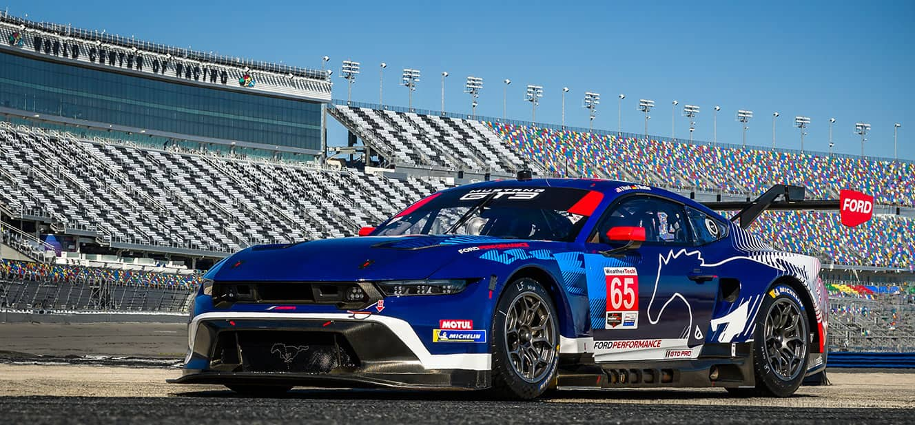 Christopher Mies' blue number 65 Ford Mustang GT3 race car on track