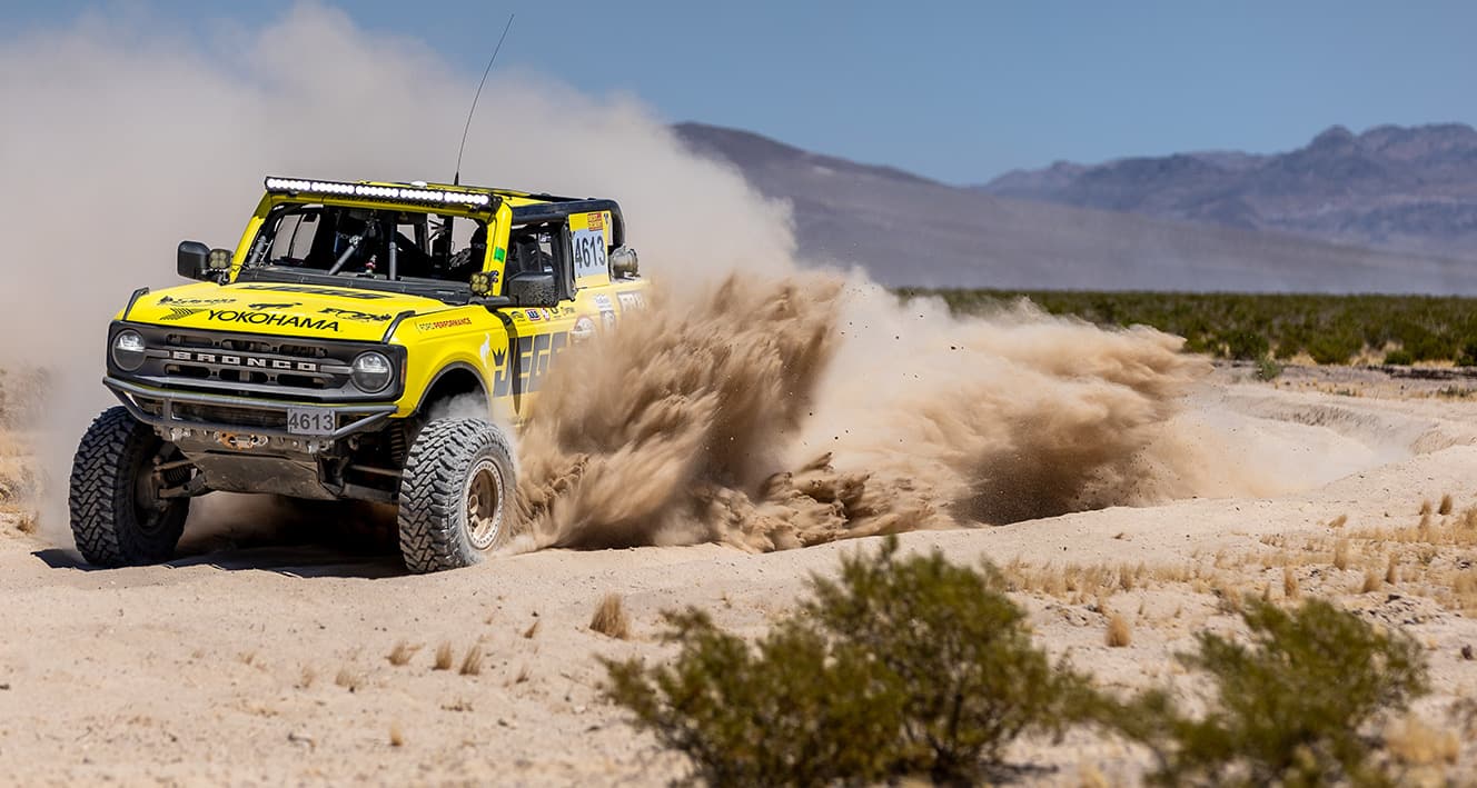 Bailey Cole’s yellow number 4613 Ford Bronco 4600 race truck off track