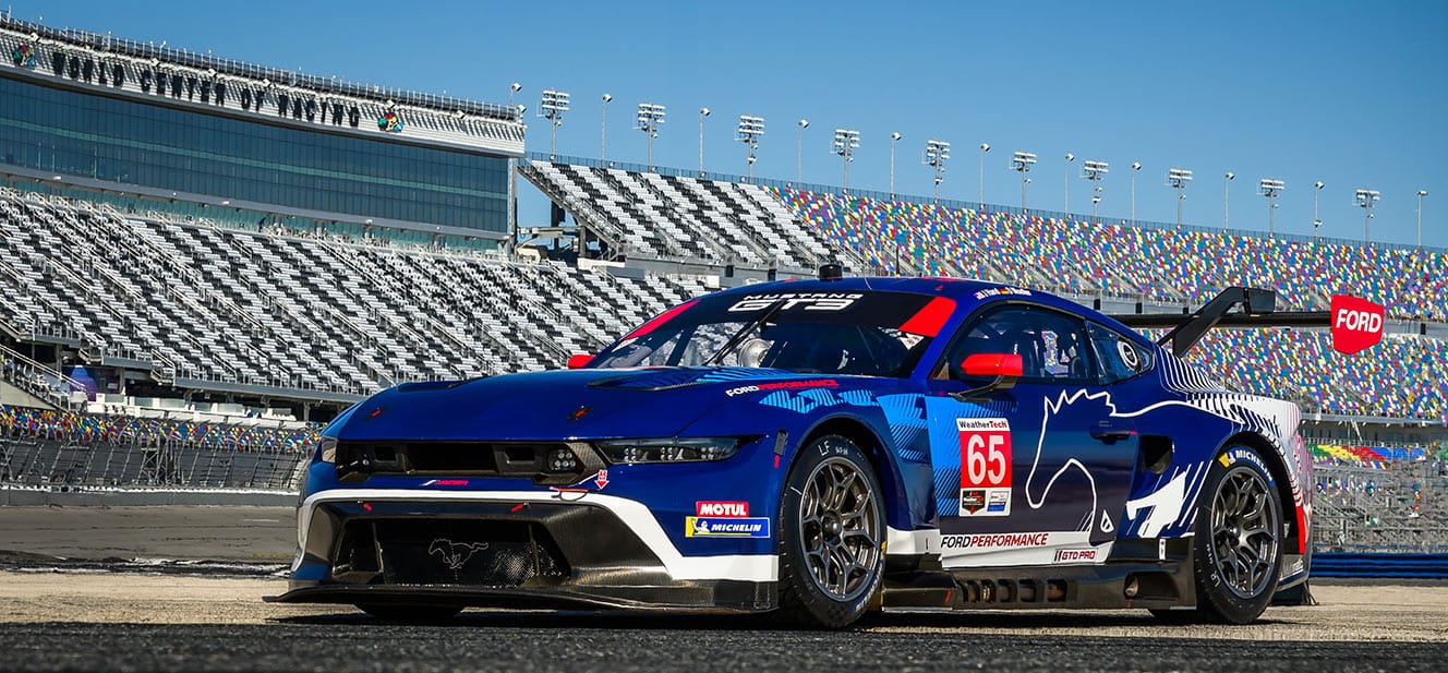 Dennis Olsen's Blue Number 65 Ford Mustang GT3 Race Car on Track