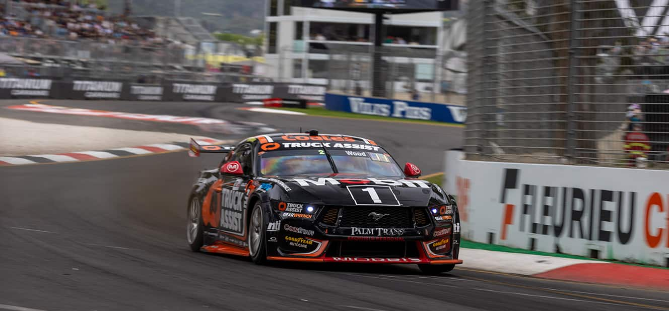 Ryan Wood’s orange and black number 2 Ford Mustang GT race car on track