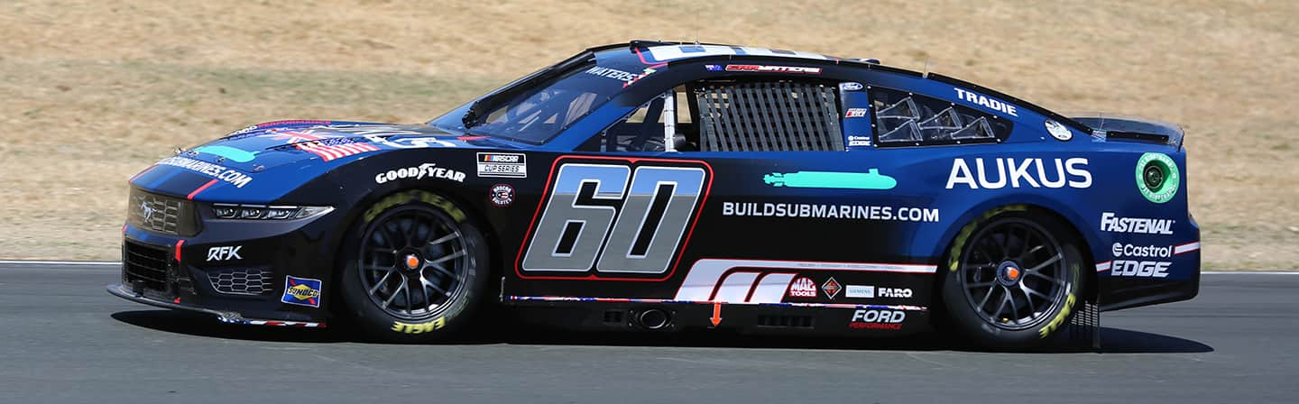 Cameron Waters' Blue and Black Ford Mustang GT race car on track