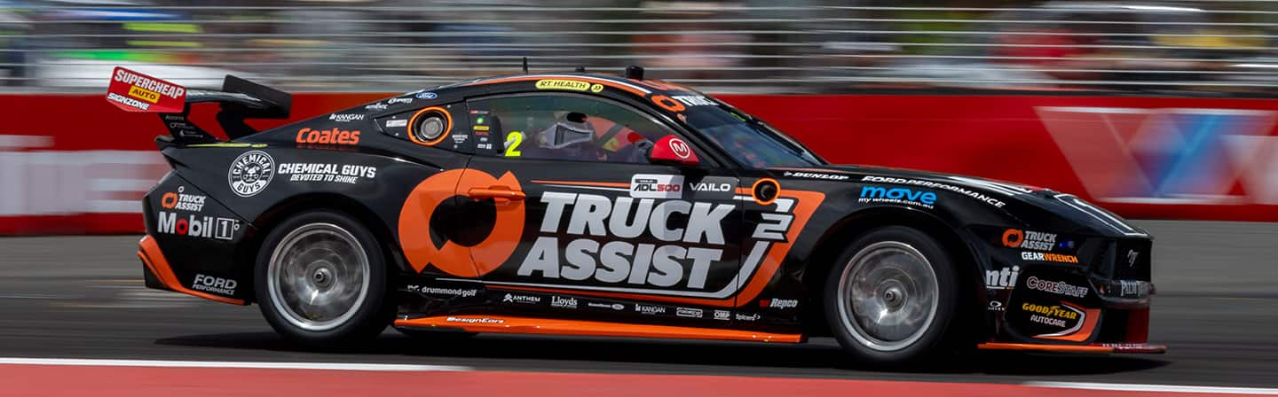 Ryan Wood’s orange and black number 2 Ford Mustang GT race car on track