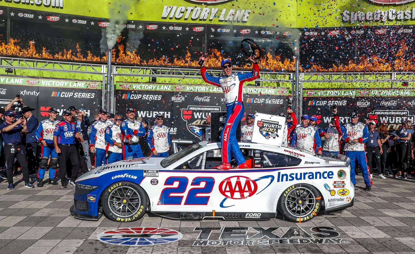 Logano celebrating at victory lane