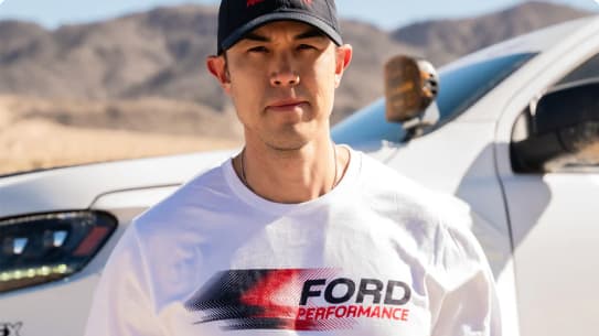 Man wearing white Ford Performance t-shirt and cap