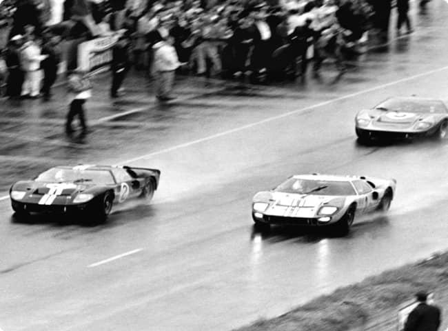 Archival image of cars on a racetrack