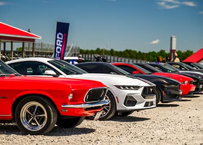 Ford cars in parking lot for a club event