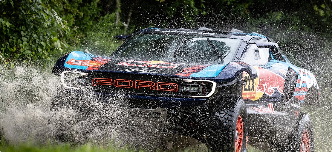 Race car in motion splashing in water