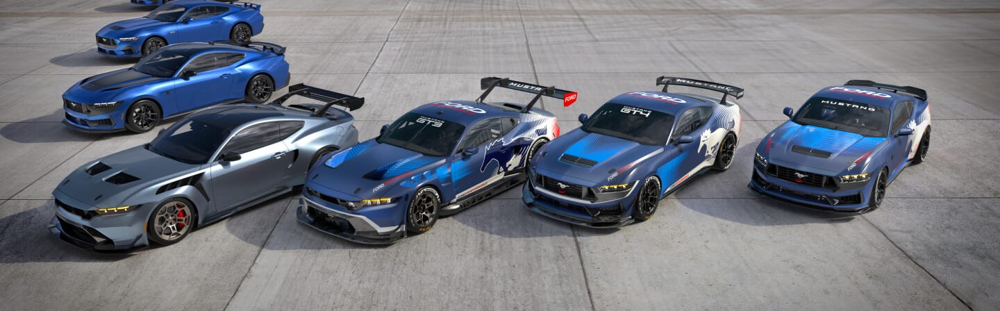 Blue and silver Ford vehicles on pavement, including GT3, GT4 and Ford Mustang race cars