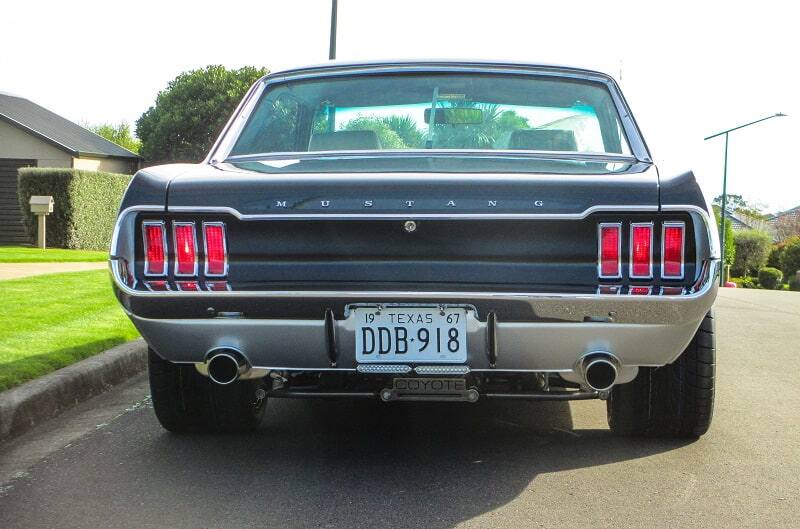 Rear view of 1967 Mustang Coupe parked on street