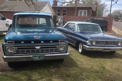 Front view of 1966 F-100 pickup truck parked next to 1964 Ford Galaxie 500