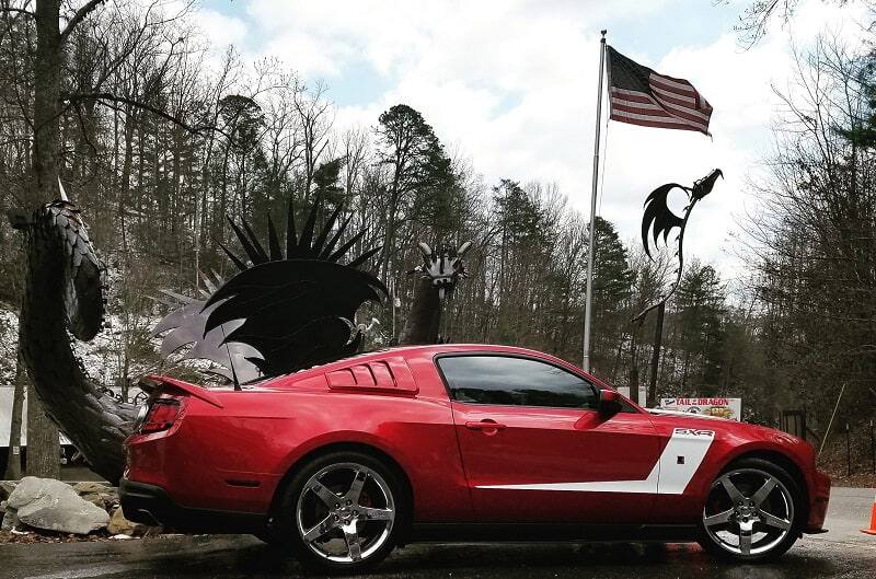 Side profile of 2015 Ruby Red 50th Anniversary Edition Mustang GT