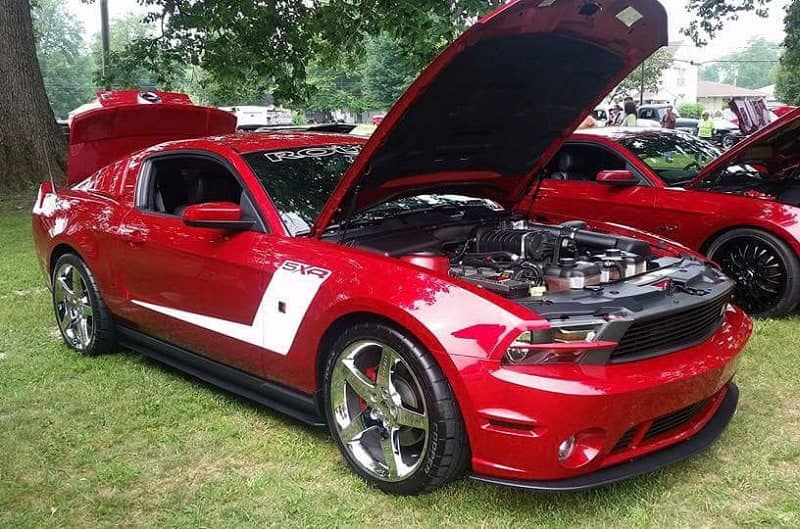 2015 Ruby Red 50th Anniversary Edition Mustang GT parked with hood open