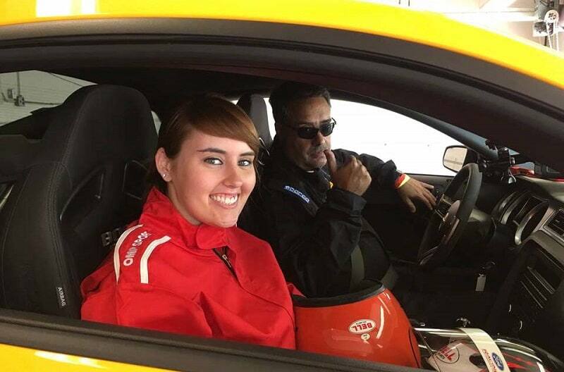 Mark and Darlene posing inside of the 2013 Mustang Boss 302 LS