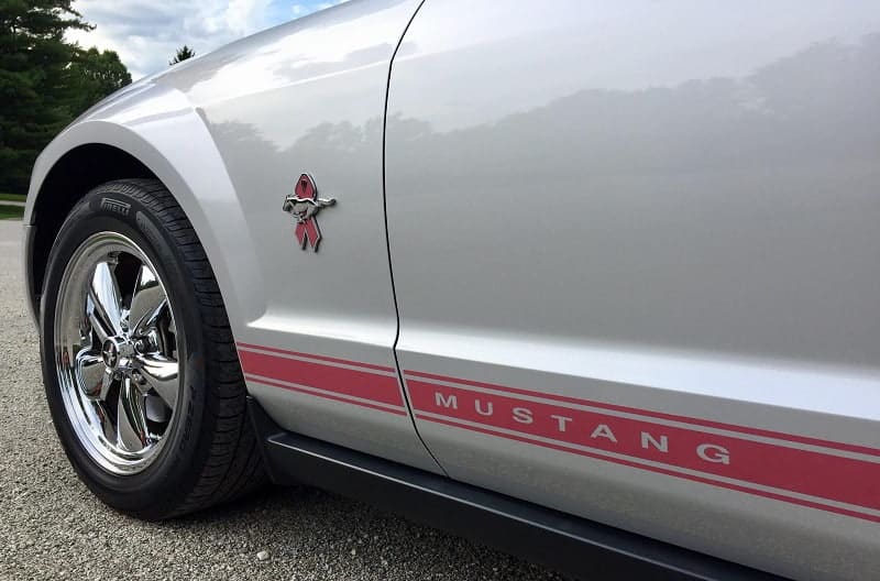 Close up of Warriors in Pink edition Mustang emblem