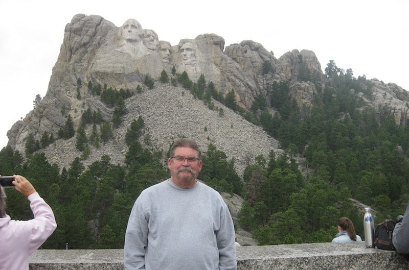 Owner Jay Cole posed in front of Mt. Rushmore