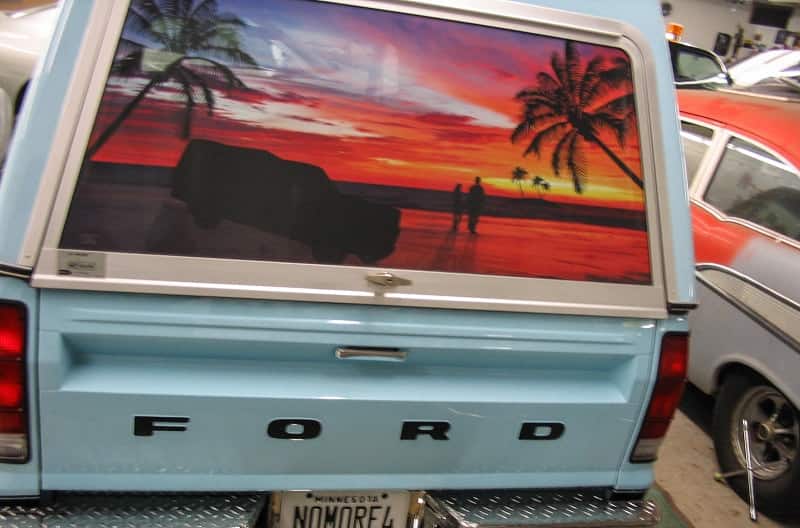 Rear view of paint job featuring beach scenery on Harlan Kemper's 1978 Ford Courier pickup truck