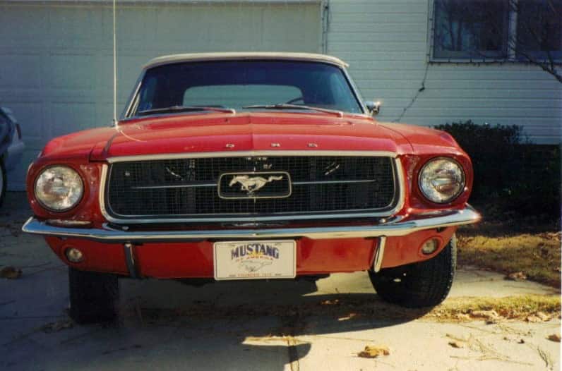 Aged photo of close view of red Mustang