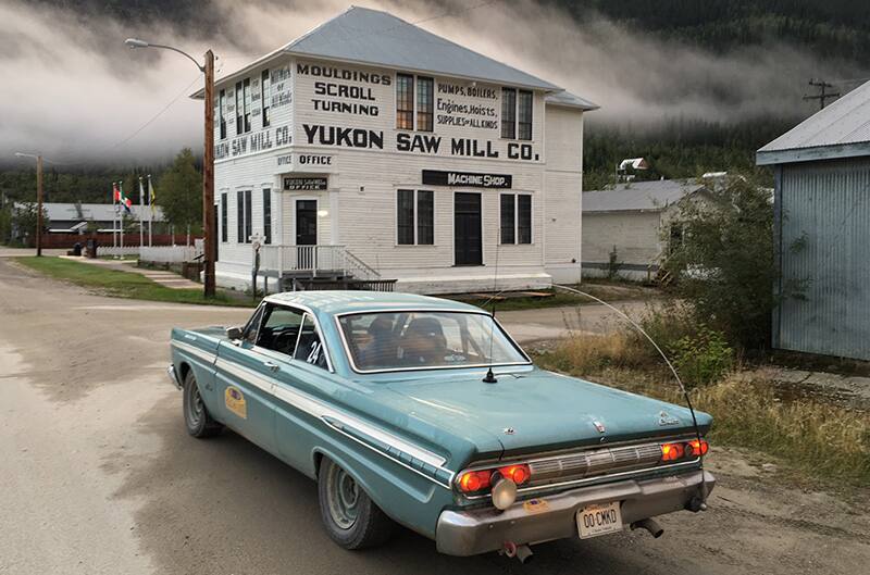 Rear view of 1964 Mercury Comet Caliente parked outside of building