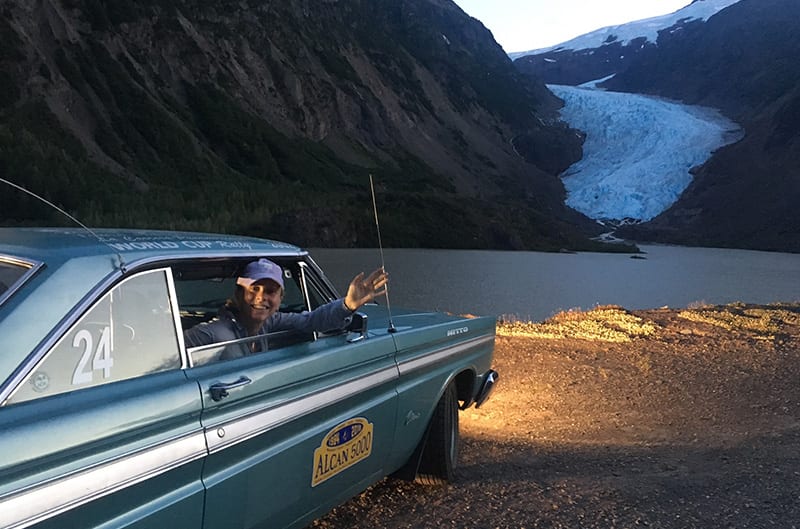 Julia Metcalf waving from inside of the 1964 Mercury Comet Caliente