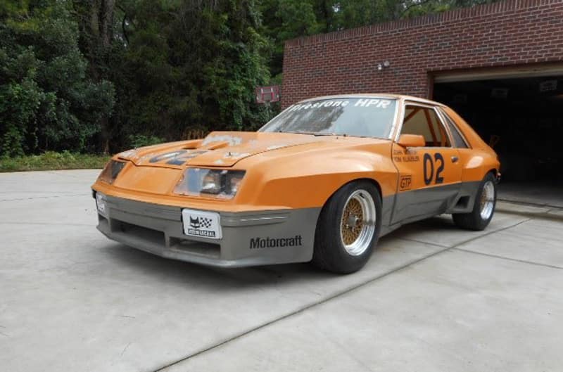 Front view of parked orange M81 McLaren