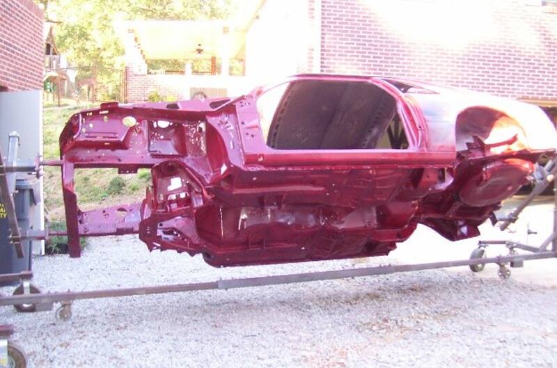 Body of red Mustang during restoration