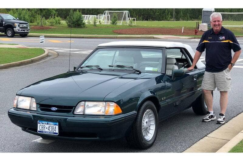 Dennis Healy driving his Kona Blue 2019 Mustang GT California Special Convertible at Ford dealership