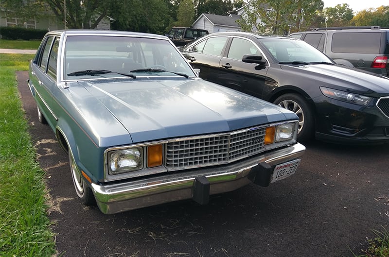 Front of a light blue Fairmont Station Wagon in the driveway