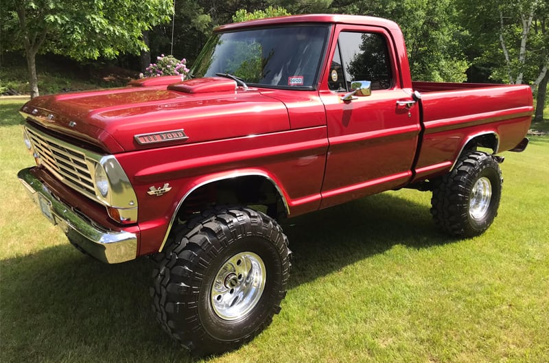 Red 1967 F100 truck with 37-inch tires