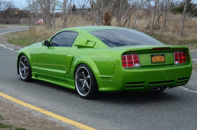 2006 Green Mustang from the back drivers side 