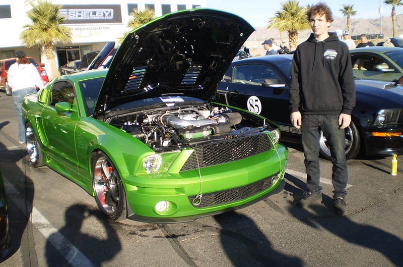 Green Monster at Car show with man standing in front of car