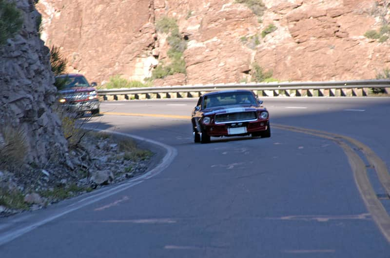 Jeff Sevison driving around curve on mountain road