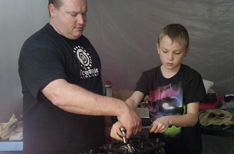 jeff and son working on mustang engine