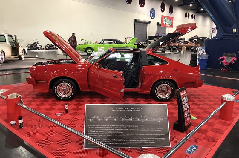 Eric Lipper's Cobra on display indoors with stantions and display board