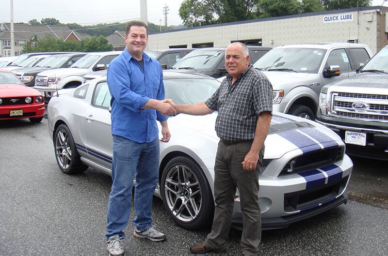 Walter taking ownership of the 2014 shelby at the dealer