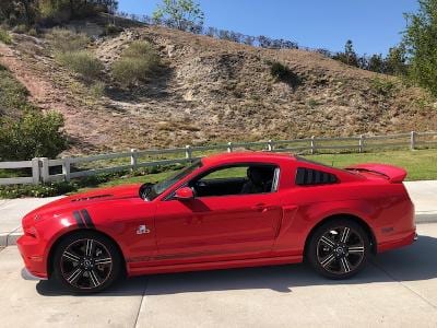 Side photo of Red S197 Mustang