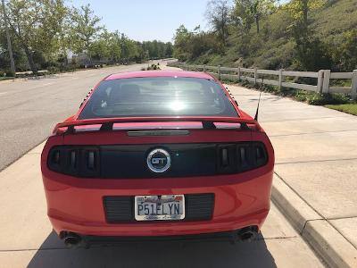 Rear photo of S197 Red GT/CS mustang parked on street