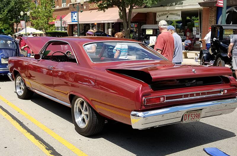 Rear photo of 1966 at car show with trunk slightly open