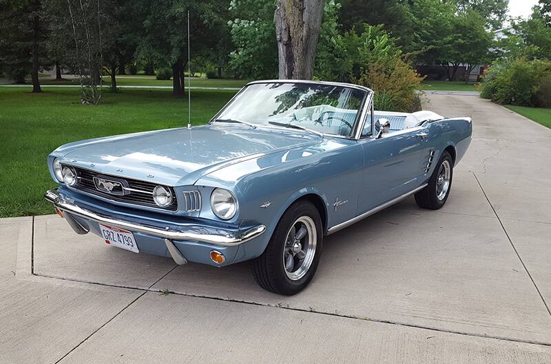 1966 Ford Mustang convertible parked in driveway