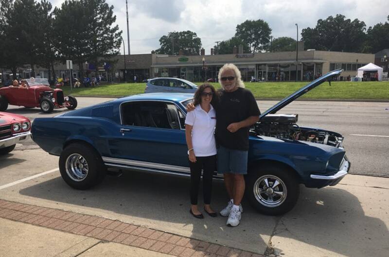 George Dallas Ford Mustang standing with his wife