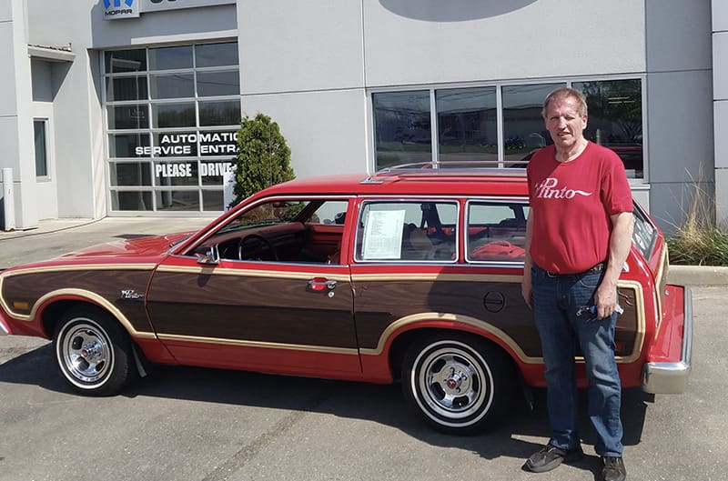 Goodman standing with his Pinto