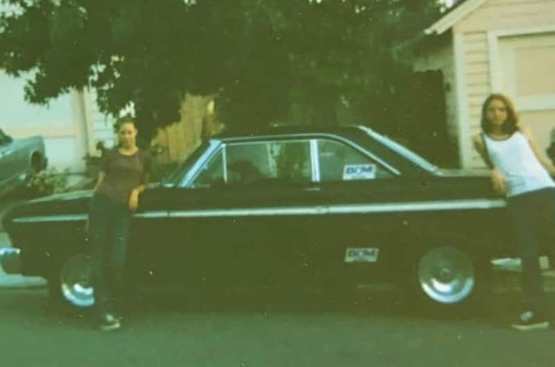 Joshs wife and friend standing with ford falcon