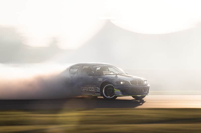 BMW drifting through thick smoke at Gridlife
