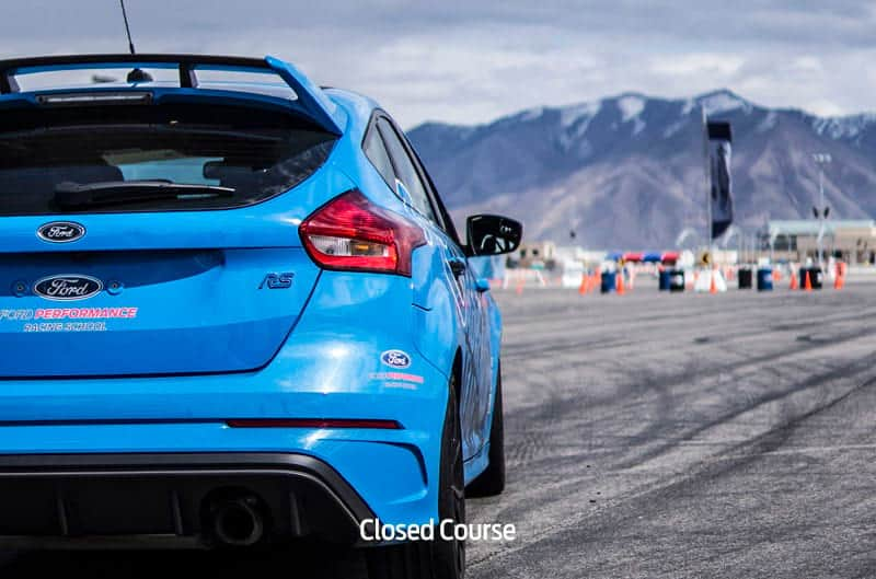 Close up rear of blue Focus RS on the course parking lot