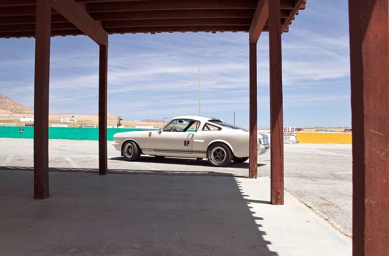 Profile of white Shelby GT on a track lot